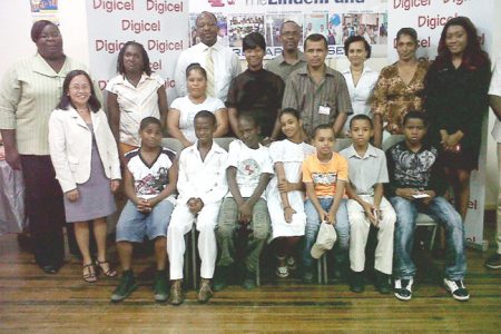Some of the students flanked by their parents, Digicel representatives, LFU members and volunteers.