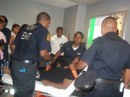 Medical personnel at JFK Airport in New York providing emergency services to the Guyanese passenger who collapsed at the airport following the announcement of the midnight flight delay yesterday.