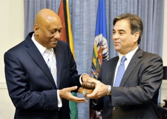 Bayney R. Karran (left), Chair of the OAS Permanent Council and Permanent Representative of Guyana to the OAS receiving the instruments of his chairmanship from Jorge Skinner-Klee, Ambassador, Permanent Representative of Guatemala to the OAS.