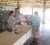 Minister of Amerindian Affairs, Pauline Sukhai (left) presents money to one of the affected residents. (GINA photo)