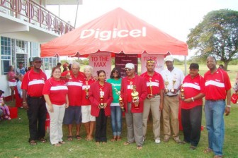 Digicel’s Chief Executive Officer Gregory Dean( right) and President of the Lusignan Golf Club Brian Hackett (left) pose with the outstanding players including Chrtistine Sukhram (fifth left) and Roger Rajkumar (seventh right).