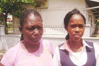 La Toya Poole (right) blood evident on her shirt collar, with her aunt Lorna Hope on the day of the incident.(SN file photo)