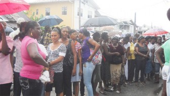 Half of the crowd outside the Lyken’s Chapel, awaiting the end of the funeral service and the exit of those in the already crowded building.