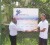 Arnold Sukhraj (left) Facilities Manager of Pegasus hands over the sponsorship cheque to tournament director Andre Lopes.
