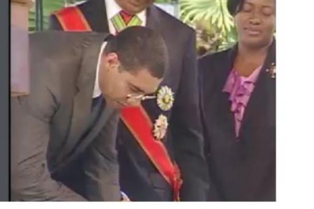 Andrew Holness being sworn in this afternoon (Jamaica Information Service photo)