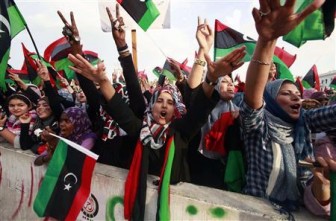 Women celebrate the liberation of Libya at Martyrs' Square in Tripoli October 23, 2011. Libya's new rulers declared the country freed from Muammar Gaddafi's 42 years of one-man rule on Sunday, saying the "Pharaoh of the times" was now in history's garbage bin and a democratic future beckoned. REUTERS/Suhaib Salem