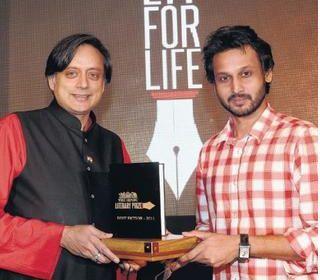 ‘A WICKET MAIDEN’: Shashi Tharoor, MP, presenting The Hindu Literary Prize for Best Fiction 2011 to debutant novelist Rahul Bhattacharya for his “The Sly Company of People Who Care” in Chennai (Hindu Times photo)