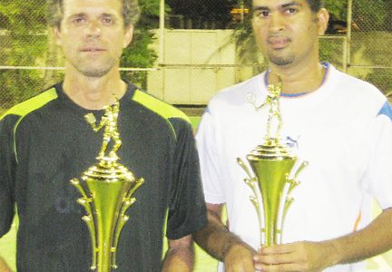 Andre Lopes (left) and Sandeep Chand pose with their winning trophies at the presentation ceremony.