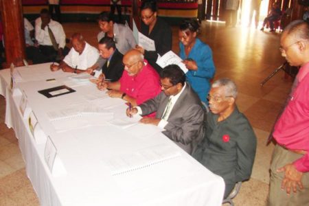 David Subnauth, leader of the East Berbice Development Association (EBDA), Peter Persaud of the TUF, Donald Ramotar, of the incumbent PPP/C, Khemraj Ramjattan of the AFC, and David Granger of the coalition APNU signing the ‘Code of Conduct for Political Parties Contesting the 2011 General and Regional Elections’ yesterday at the Umana Yana. (Photo courtesy of demwaves.com)
