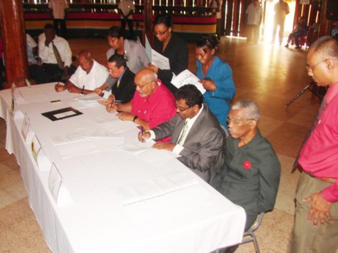 David Subnauth, leader of the East Berbice Development Association (EBDA), Peter Persaud of the TUF, Donald Ramotar, of the incumbent PPP/C, Khemraj Ramjattan of the AFC, and David Granger of the coalition APNU signing the ‘Code of Conduct for Political Parties Contesting the 2011 General and Regional Elections’ yesterday at the Umana Yana. (Photo courtesy of demwaves.com)