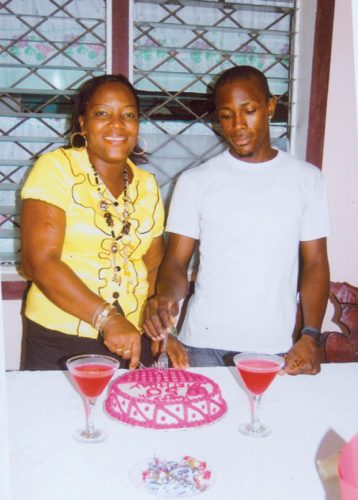 Winifred Watson and her 19-year-old son Stephen sticking a cake to celebrate her 50th birthday. 