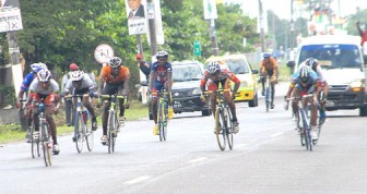  Riders powering to the finish line during the 40km cycle road race yesterday.