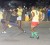 A striker shoots into traffic during Tuesday night’s Guinness Greatest-of-the-Streets football tournament at the National Cultural Centre tarmac. (Orlando Charles photo)