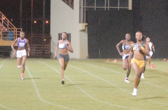 Letitia Myles comfortably crosses the finish line in the girl’s under-20 200 metres to record her sprint triple.