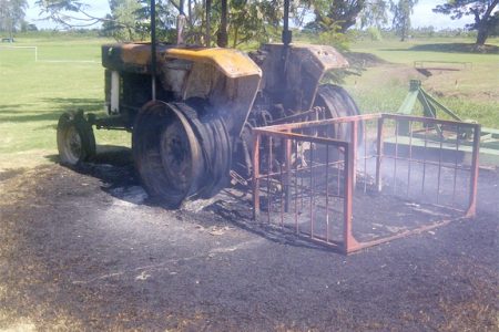 An intruder set this tractor afire on Sunday evening while it was parked in the yard of the Lusignan Golf Course