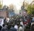 Protesters enter the opened gate of the British embassy in Tehran yesterday. REUTERS/Stringer