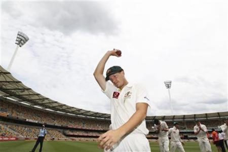 Australia’s James Pattinson acknowledges the crowd after his 5 wickets against New Zealand during their first test cricket match at the Gabba in Brisbane yesterday. Credit: Reuters/Jason O’Brien.