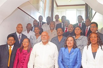 President Donald Ramotar (third, left front) with his Cabinet after the swearing-in at State House yesterday (Photo by Anjuli Persaud)