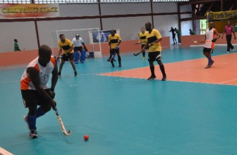 A GCC player  prepares to pass the ball during his team’s game with ABC of Trinidad.