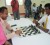Minister of Culture, Youth and Sport Dr Frank Anthony makes a move with the white pieces against former national junior chess champion Cecil Cox of Queen’s College to declare open the fourth annual national schools’ chess tournament.