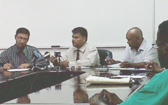 In photo, Guyana Power and Light’s Deputy Chief Executive  Officer, Aeshwar Deonarine  signs the 8% wage increase agreement while to his left CEO of the company  Bharat Dindyal   and  NAACIE’s President, Kenneth Joseph look on.