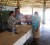 Minister of Amerindian Affairs Pauline Sukhai presents monetary assistance to a Region 9 resident who was affected by flood earlier this year. (GINA photo) 
