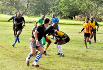 Players from the national Sevens rugby team going through a practice session yesterday at the National Park. (Aubrey Crawford photo)