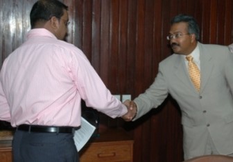 Fip Motilall (right) meeting President Bharrat Jagdeo at the Office of the President in 2007 on the Amaila Falls project. (Office of the President photo)