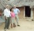 A recipient of the Tabatinga Flood Relief aid poses with CFLI Coordinator, Ann Geer (left) and Head of Aid, CIDA Raymond Drouin (left) in the Region Nine community. 