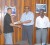 Sean Devers, second from left, receives the donation from Guyana Cricket Board (GCB) President Ramsey Ali, while Reon Griffith (left), Colin Europe (second from right) and Sanjeev Datadin (right) look on.(Orlando Charles photo)