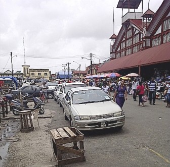 Private hire cars lining the strip outside Stabroek Market that vendors were told would be cleared for pedestrians 