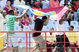 FAN FRENZY! Fans celebrate with the West Indies and St Lucia flags.
