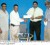 NCN Regional Co-ordinator Mr. Faizal Jafarally hands over sponsorship cheque  Treasurer Anil Beharry