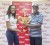 Digicel’s Public Relations Officer Shonnett Moore is all smiles as she presents the sponsorship trophy to organizing secretary Compton Sancho.