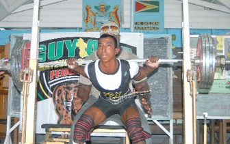 RECORD BREAKER! Vijai Rahim during his record breaking squat at the 2012 Novices and Intermediate Powerlifting competition in February. (Orlando Charles photo)