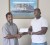 Managing Director of Mohammed’s Enterprise and the City Mall Nazar Mohamed (Left) hands over the cheque to HRC’s Sponsorship and Finance Officer Dexter Garnett.           