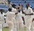 Left-arm spinner Sulieman Benn, right celebrates the fall of another Jamaican batsman’s wicket. Benn picked up 5-90. (Westindiescricket.com)