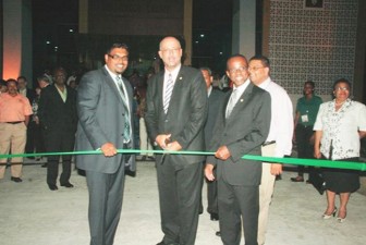 Chairman of the Caribbean Tourism Organisation,  Ricky Skerritt cutting the ribbon in the presence of Minister of Tourism,  Industry and Commerce (ag) Irfaan Ali (left) and CTO Secretary General Hugh Riley. (GINA photo)