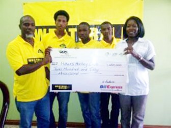 GKRS Marketing Manager, Natheeah King- Mendonca (right), presents the sponsorship cheque to Manager of the Hikers Junior Programme, Michael Harding. Players Leon Bacchus, Aroydy Bradford and Andrew Stewart look on approvingly.