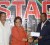 Managing Director of Ansa McAL, Beverley Harper hands over a sponsorship cheque to acting president of the Guyana Football Federation (GFF) Franklin Wilson while General Secretary of the GFF Noel Adonis looks on. (Orlando Charles photo)