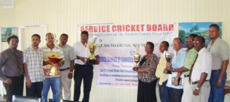 Members of the Berbice Chamber and Berbice Cricket Board with the trophies for the tournament.