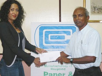 Company Secretary and Administrative Director of Caribbean Container Inc, Ms. Patricia Bacchus hands over the sponsorship cheque at the company’s head office, Farm, East Bank Demerara to secretary of the GCF Vishnu Rampersaud.   