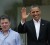 President Barack Obama waves (R) while standing next to his Colombian counterpart Juan Manuel Santos after his arrival at the convention center where the Americas Summit is being held in Cartagena, April 14, 2012. Heads of state are meeting here from April 14-15. REUTERS/Enrique Marcarian