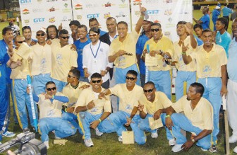REGAL TRIUMPH! The victorious regal team and its supporters after winning the male Open category of the third annual GT&T softball cricket tournament Saturday night at the Providence National Stadium. (Orlando Charles photo)