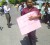 Romel Roopnarine, Public Relations Officer for the PPP protesting the budget cuts yesterday.