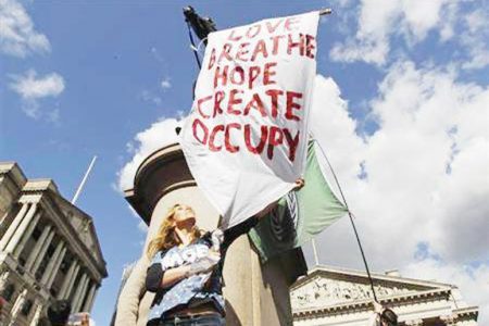 A demonstrator protests during a rally by the Occupy movement outside the Bank of England yesterday. (Reuters/Luke MacGregor)