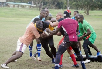 Members of the national 15s rugby team going through a practice session yesterday at the National Park ahead of their first game in Round 2 of the Southern Zone of the NACRA Regional Qualifier for the 2015 Rugby World Cup which kicks off in Barbados tomorrow.(Orlando Charles photo)