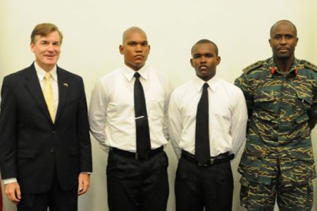 The cadets pose with US Ambassador Brent Hardt (left) and GDF Colonel Bruce Lovell (right)