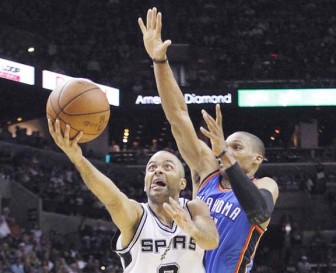San Antonio Spurs point guard Tony Parker gets past Oklahoma City Thunder point guard Russell Westbrook to score in the fourth quarter during Game 2 of the NBA Western Conference basketball finals in San Antonio on Tuesday. MIKE STONE/REUTERS