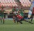 National rugby player Claudius Butts (with ball) on the attack during Guyana’s 20-nil mauling of Trinidad and Tobago’s Calypso Warriors yesterday at the Providence National Stadium in the Southern Zone of the NACRA Regional Qualifiers for the 2015 Rugby World Cup. (Orlando Charles photo)